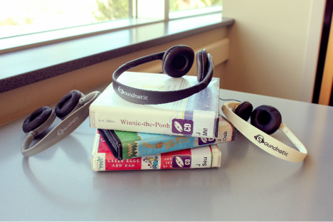 Headphones on top of a stack of books